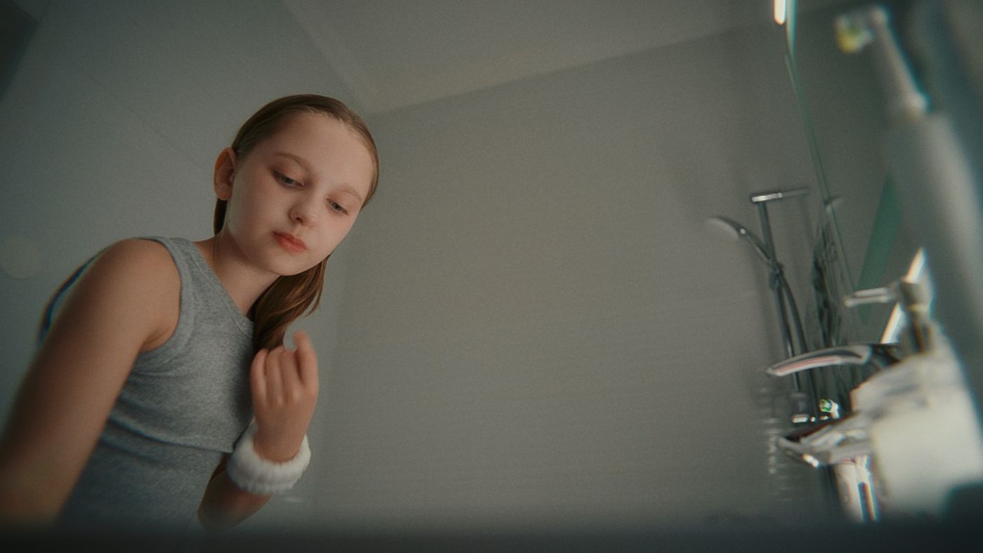 A girl in a bathroom, low angle