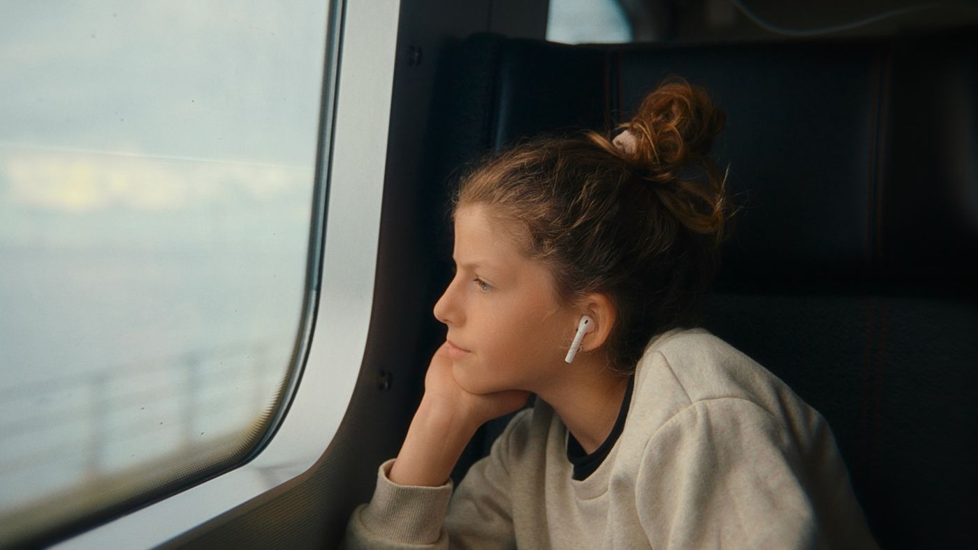 A girl on a train by the window
